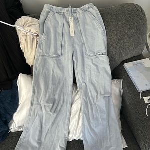 Small she + sky baggy jean material pants. Never worn. tags still on.